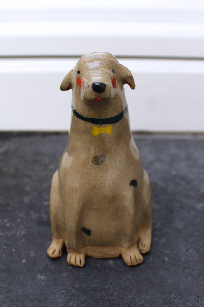 Dog sculpture ceramic.