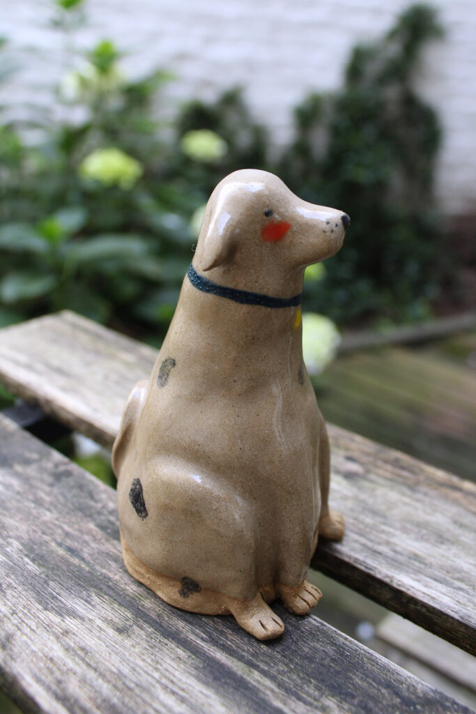 Dog sculpture ceramic.