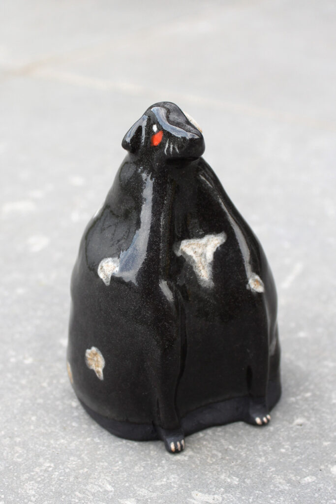 Black dog ceramic sculpture